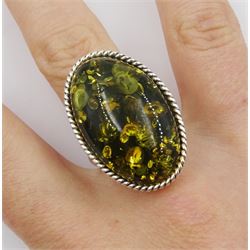 Silver oval Baltic amber adjustable ring, stamped 925 