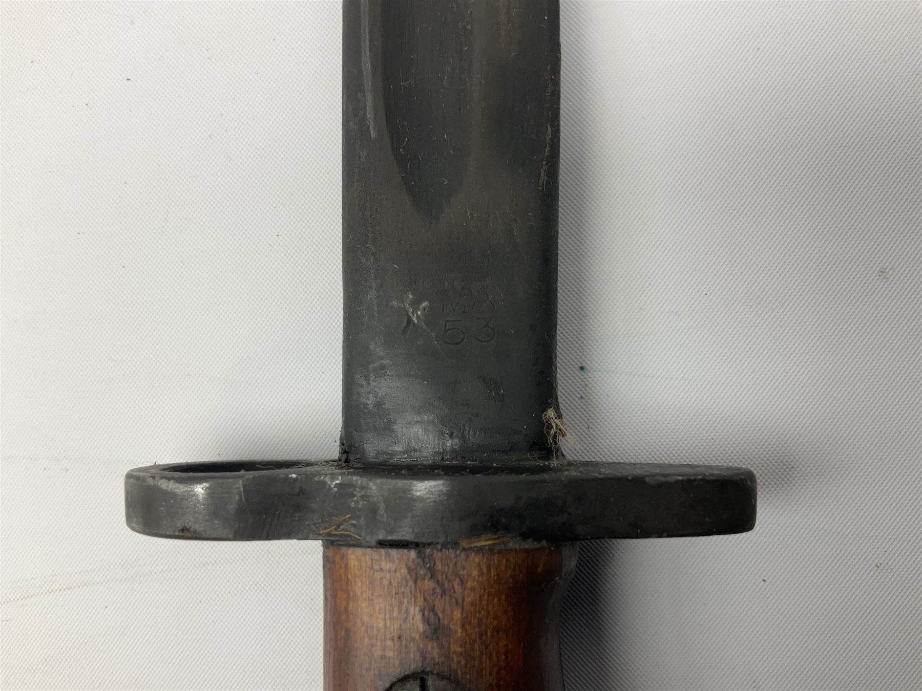 Australian Owen sub-machine gun bayonet, the 25.5cm fullered steel blade marked '53'; in metal bound wooden scabbard marled MA53 L41cm overall