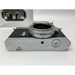 Nikkormat FT2 camera body, serial no. 5066813, in original packaging, together with Nikkormat EL camera body, serial no. 5577358, with Nikon Nikkor 50mm 1:1.8' lens no. 2143575, Nikkormat FT, serial no. 3968385, and Nikomat FT camera body, serial no. 4015491