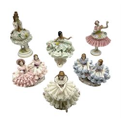 Six Dresden figures and figure groups of lace crinoline ladies, to include a spanish dancer, a dancer holding a flower with a flower encrusted skirt, etc 