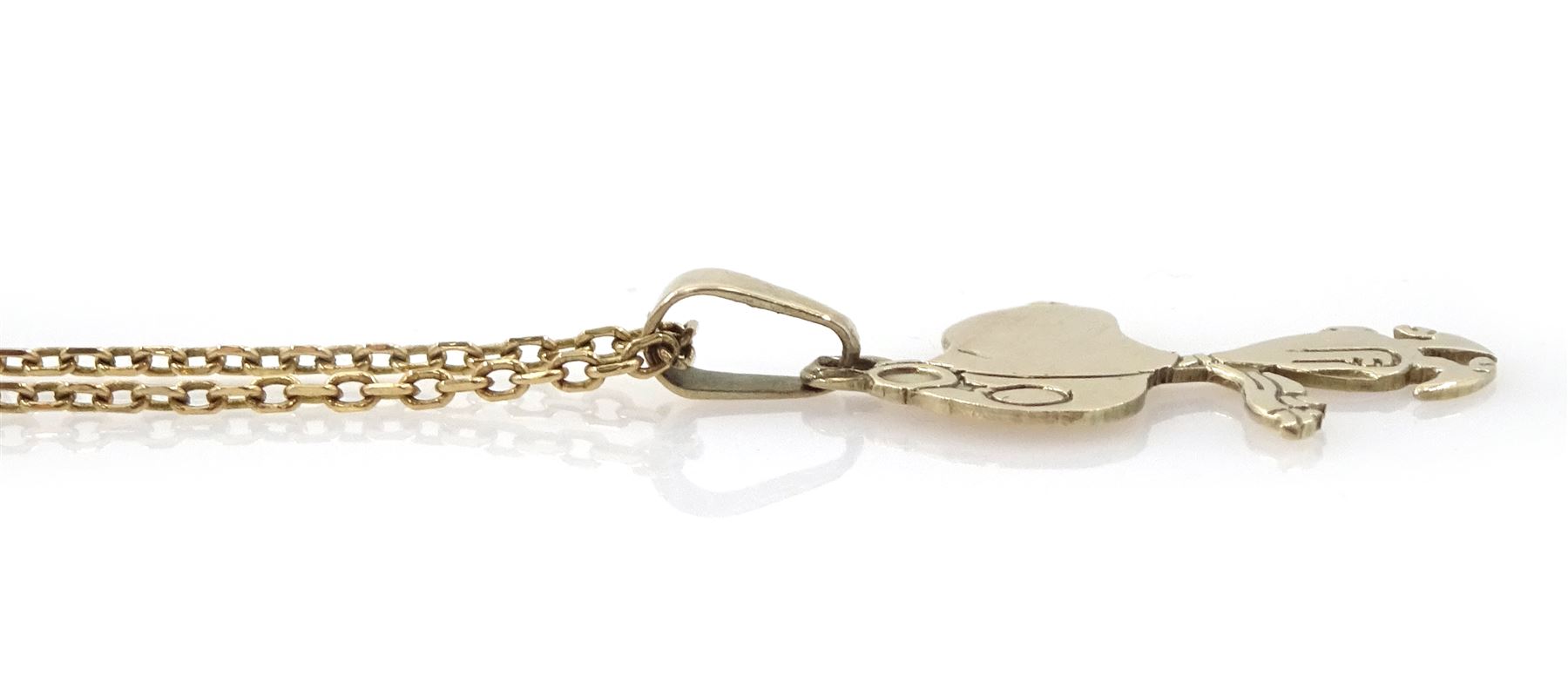 9ct gold 'Snoopy' pendant by Aviva United Feature, on 9ct gold chain necklace, both London import mark 1979