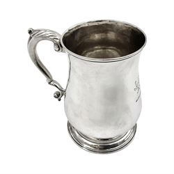 George II silver tankard, of waisted baluster form with acanthus capped C scroll handle, the body engraved with a lion rampant, upon a circular spreading foot, hallmarked Gabriel Sleath & Francis Crump, London 1754, H13cm