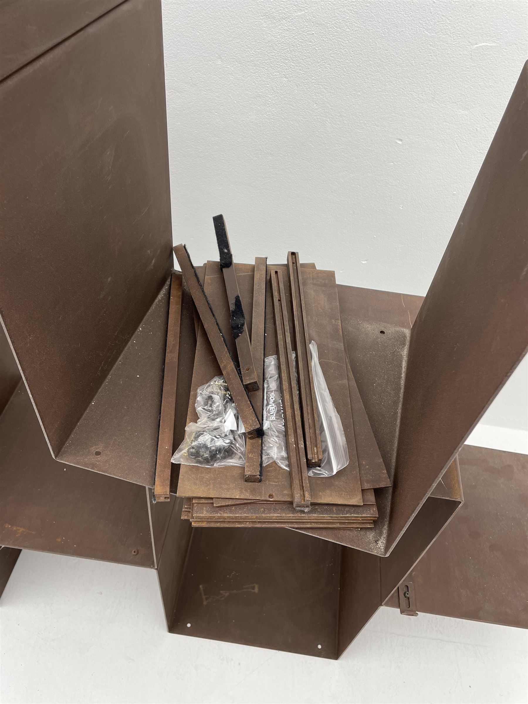 Retailed by The Conran Shop - four sectional modular shelving units, rusted metal finish, each unit - W212cm, H71cm, D33cm