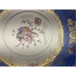 Set of three Victorian teacups and saucers, with matching dessert plate, decorated with a watered silk blue boarder and hand painted floral sprays to the centre 