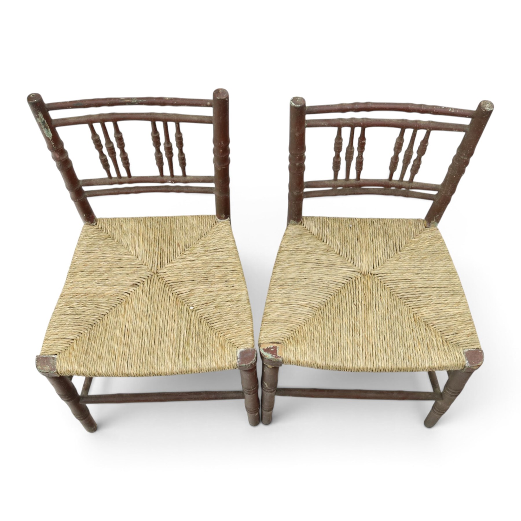 Pair of 19th century lacquered faux bamboo rush seated side chairs chairs, original blue paint under later ox-blood lacquer finish