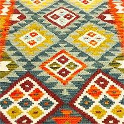 Afghan Maimana kilim flatweave runner, central field features a large bold nested diamond motifs and stylized geometric lozenge patterns on crimson, olive purple, blue, and green tone ground, border stripe in teal ground, and fringe