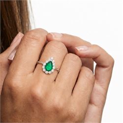 18ct white gold emerald and diamond cluster ring, single pear cut emerald of approx 1.40 carat, surrounded by twelve round brilliant cut diamonds, in a milgrain setting, stamped 750, total diamond weight approx 0.55 carat