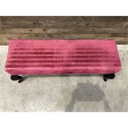 Large rectangular footstool upholstered in a maroon fabric with cabriole supports