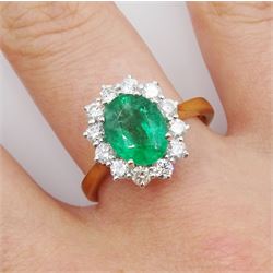 18ct gold oval emerald and round brilliant cut diamond cluster ring, hallmarked, emerald approx 1.95 carat, total diamond weight approx 0.65 carat