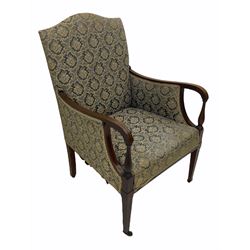 Edwardian inlaid mahogany upholstered chair, shaped arms and turned arm supports, square tapering front supports terminating at brass castors 