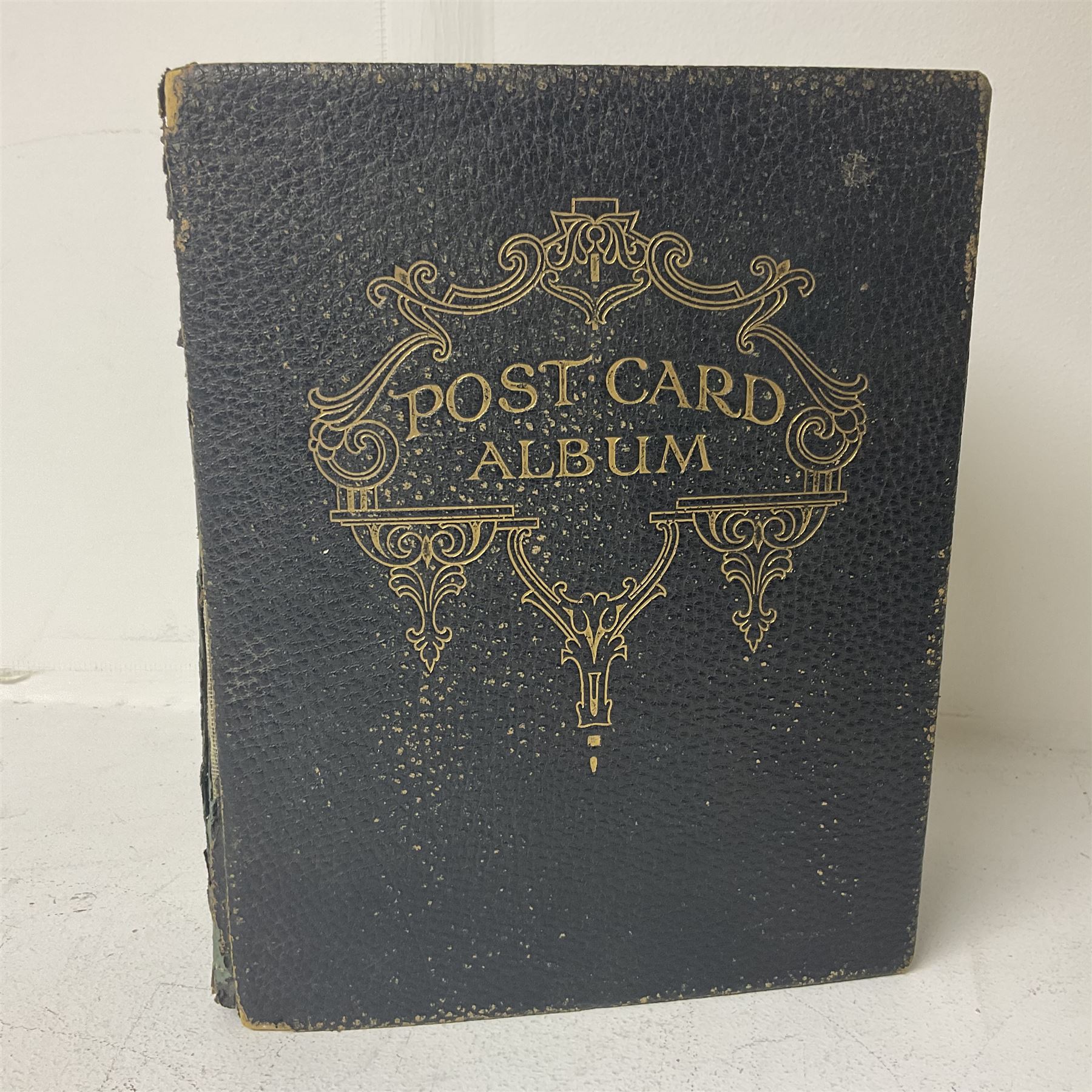 Postcard album with Victorian and later postcards, including silk cards, landscapes of the UK, portraits, Christmas cards etc  