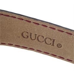 Gucci gold-plated rectangular quartz wristwatch, Ref. 2600M, red and silvered dial, on original red leather strap, boxed