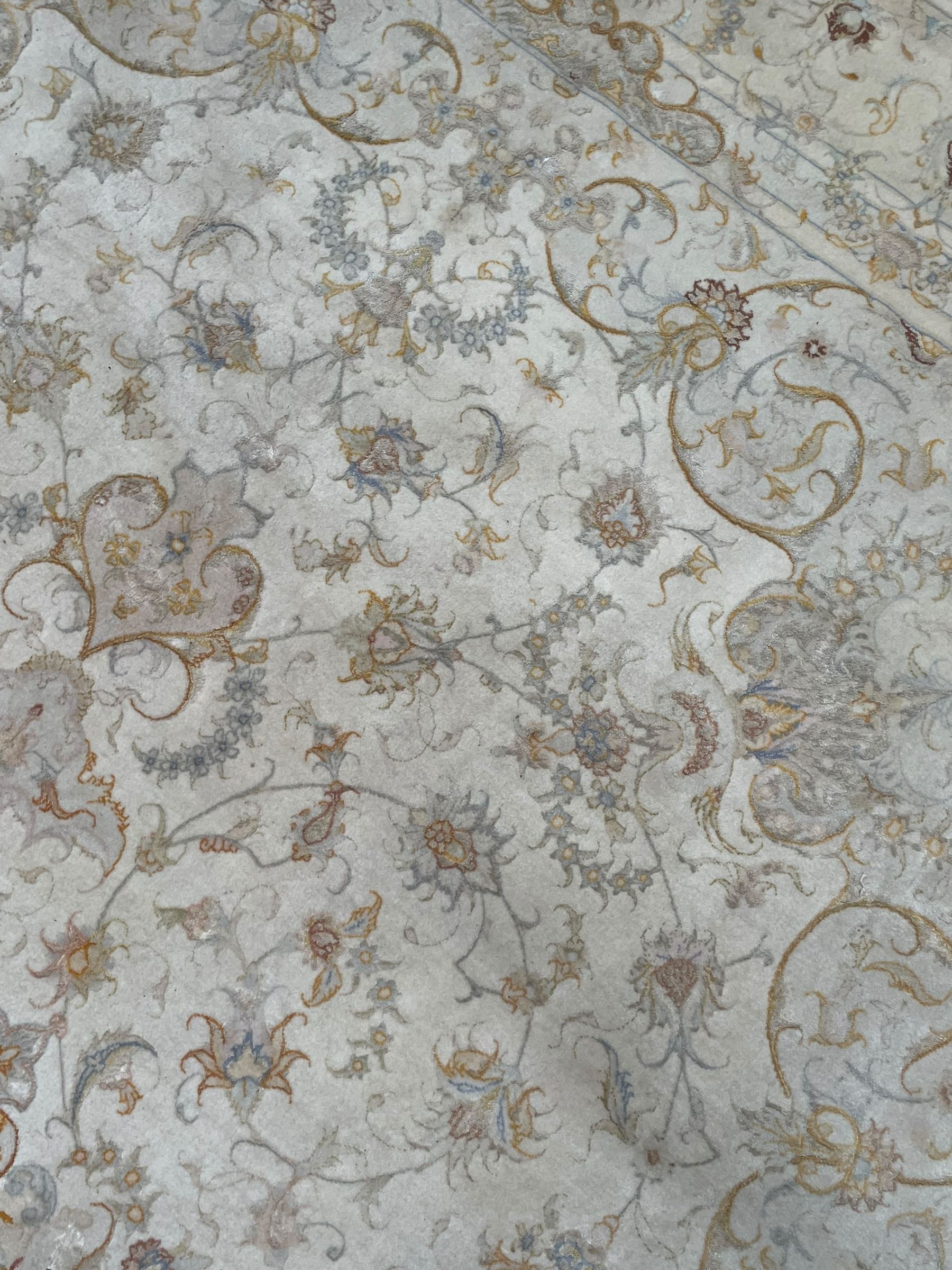 Persian Mahal densely knotted ivory ground carpet, floral rosette medallion surrounded by interlacing leafy branches and palmettes, scrolling border decorated with foliate motifs, within guard stripes, with signature panels to each end