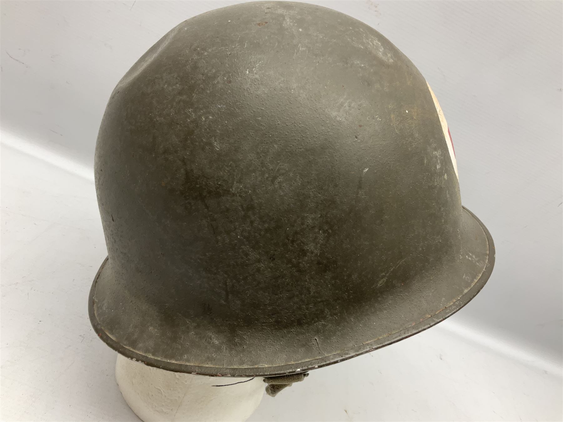 French Algerian War Red Cross steel helmet, marked 'CP ICA Esperaza 1955'; green finish with crudely painted Red Cross logo to the front