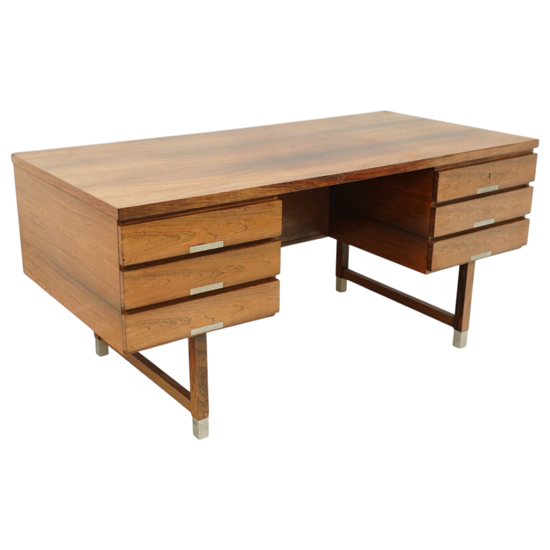 Mid-20th century rosewood pedestal desk, the rectangular top above twin pedestals each fitted with three drawers, all with recessed metal pulls, raised on square legs with stretcher supports and capped metal feet