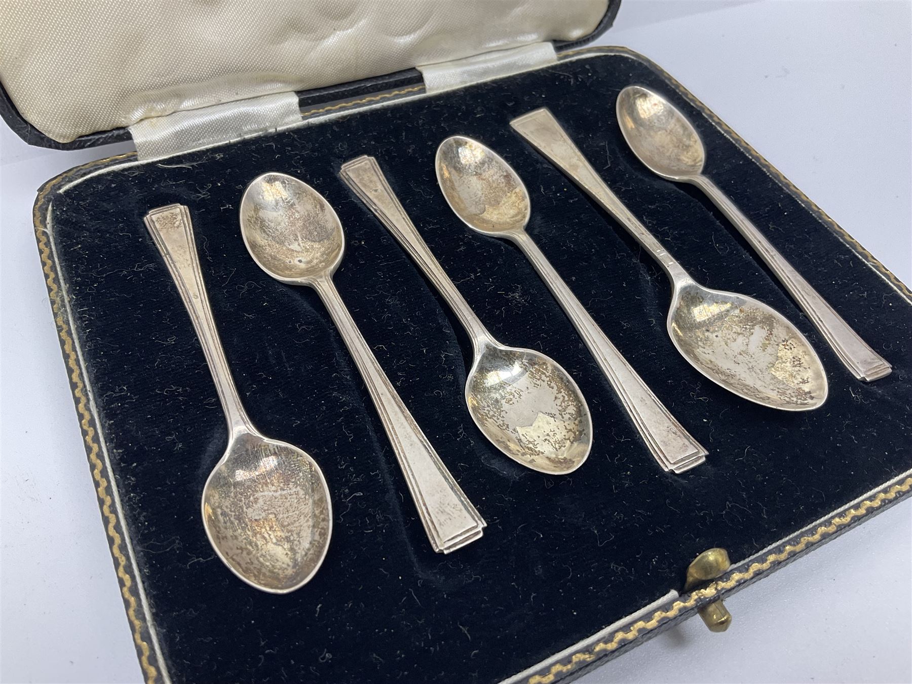 Five silver coffee spoons, together with one other, hallmarked, silver jewellery and costume jewellery in a wooden jewellery box