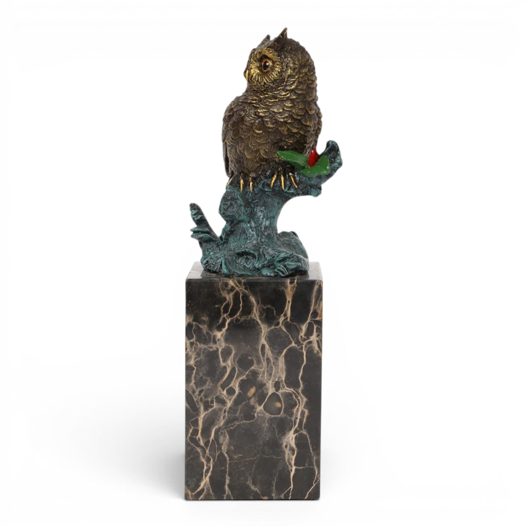 Cold painted bronze figure, modelled as an owl perched upon a tree stump signed Milo and with foundry mark, raised upon black veined marble plinth, H27.5cm