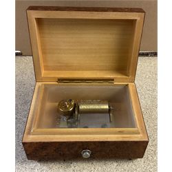 20th century burr wood Swiss musical box, marbled beneath 'made in Switzerland', paper label inscribed 'Around the world The Lass of Richmond Hill', H6.5cm W12.5cm D9cm