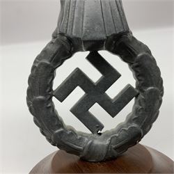 WW2 German cast white metal desk ornament/paperweight as the eagle insignia on later turned mahogany plinth H22cm