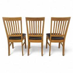 Contemporary set of six light oak dining chairs with faux leather cushion seats 
