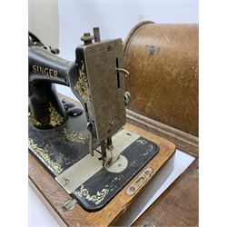 Two vintage sewing machines, the first marked Federation, in mahogany case, the second marked Singer, in oak case. 
