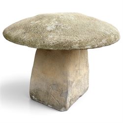 Weathered cast stone two-piece staddle stone of squat form, domed circular top over square...