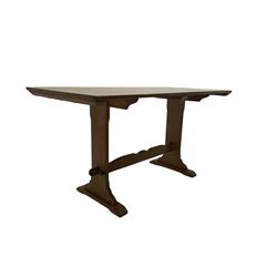 Mid-20th century rectangular oak dining table, shaped solid end supports joined by stretcher on sledge feet 