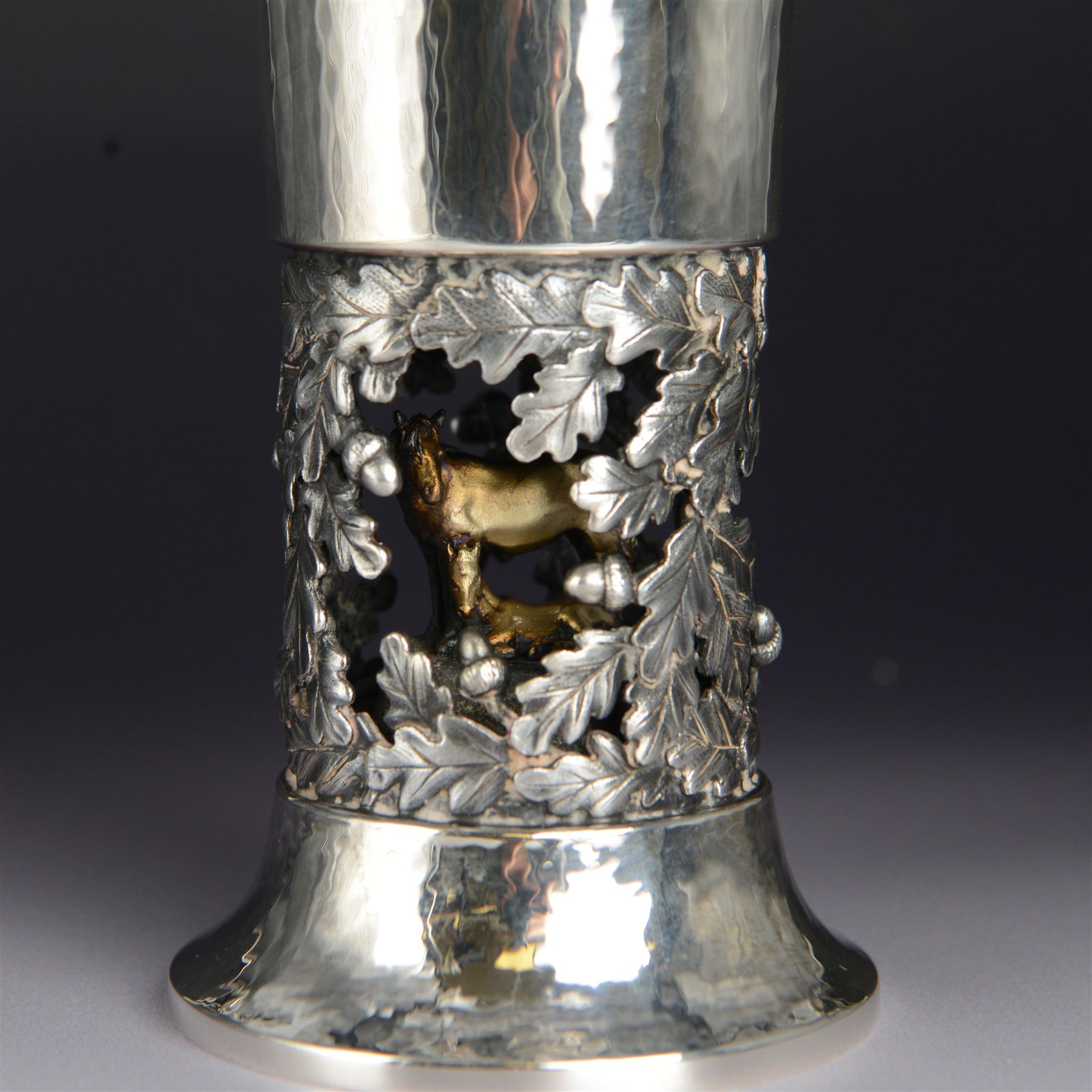 Modern limited edition silver goblet, 'by order of The New Forest of Ninth Centenary Trust this goblet has been produced to mark the 900th anniversary of the Forest in 1979' designed by Hector Miller for Aurum, the fluted planished bowl with gilt interior, upon a stem decorated in relief with oak leaves and acorns revealing a harse and foal to centre, limited edition no. 375, hallmarked Hector Miller, London 1980, H16.5cm, boxed