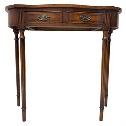 Regency design mahogany serpentine console table, fitted with single drawer disguised as two with cockbeaded facia, raised on fluted tapering supports