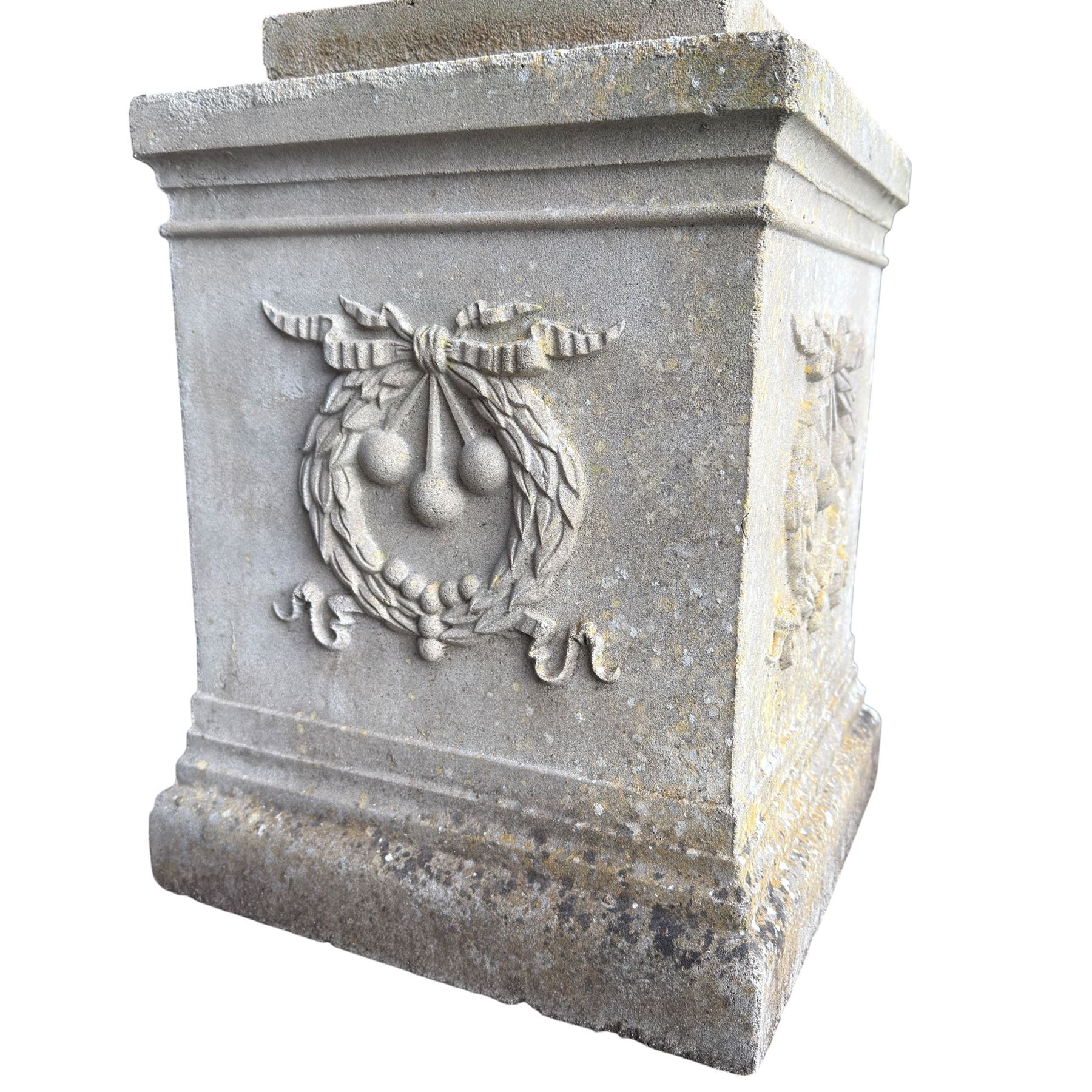 Pair of quality Neoclassical design Haddonstone cast stone garden urns, the globular  body decorated with relief foliate festoons and fruiting motifs, over a fluted socle, the rectangular pedestals with relief foliate wreaths and ribbon garlands
