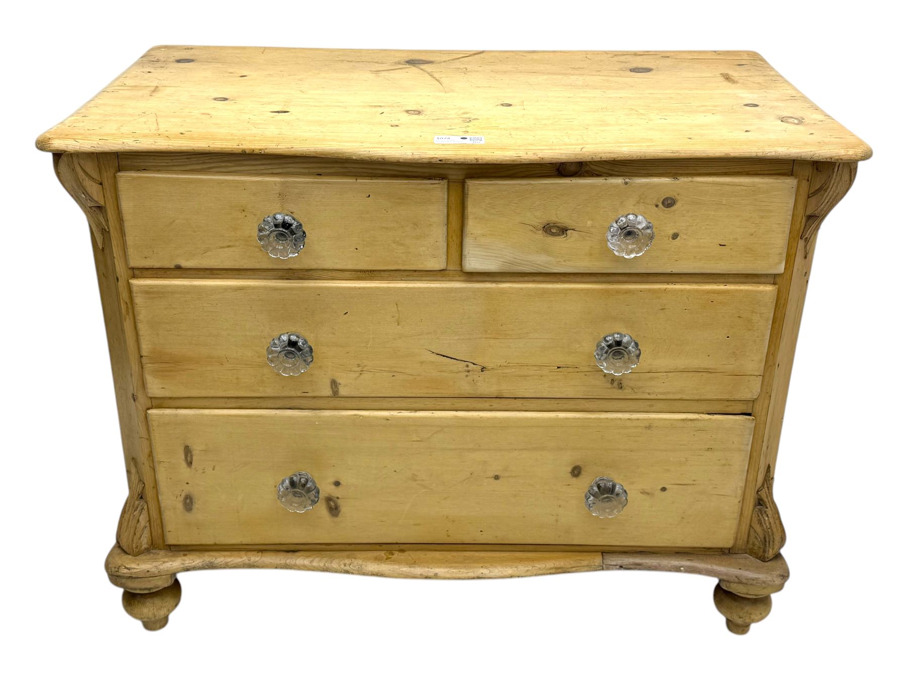 19th century continental pine chest, shaped serpentine top over two short and two long graduated drawers, on turned bun supports