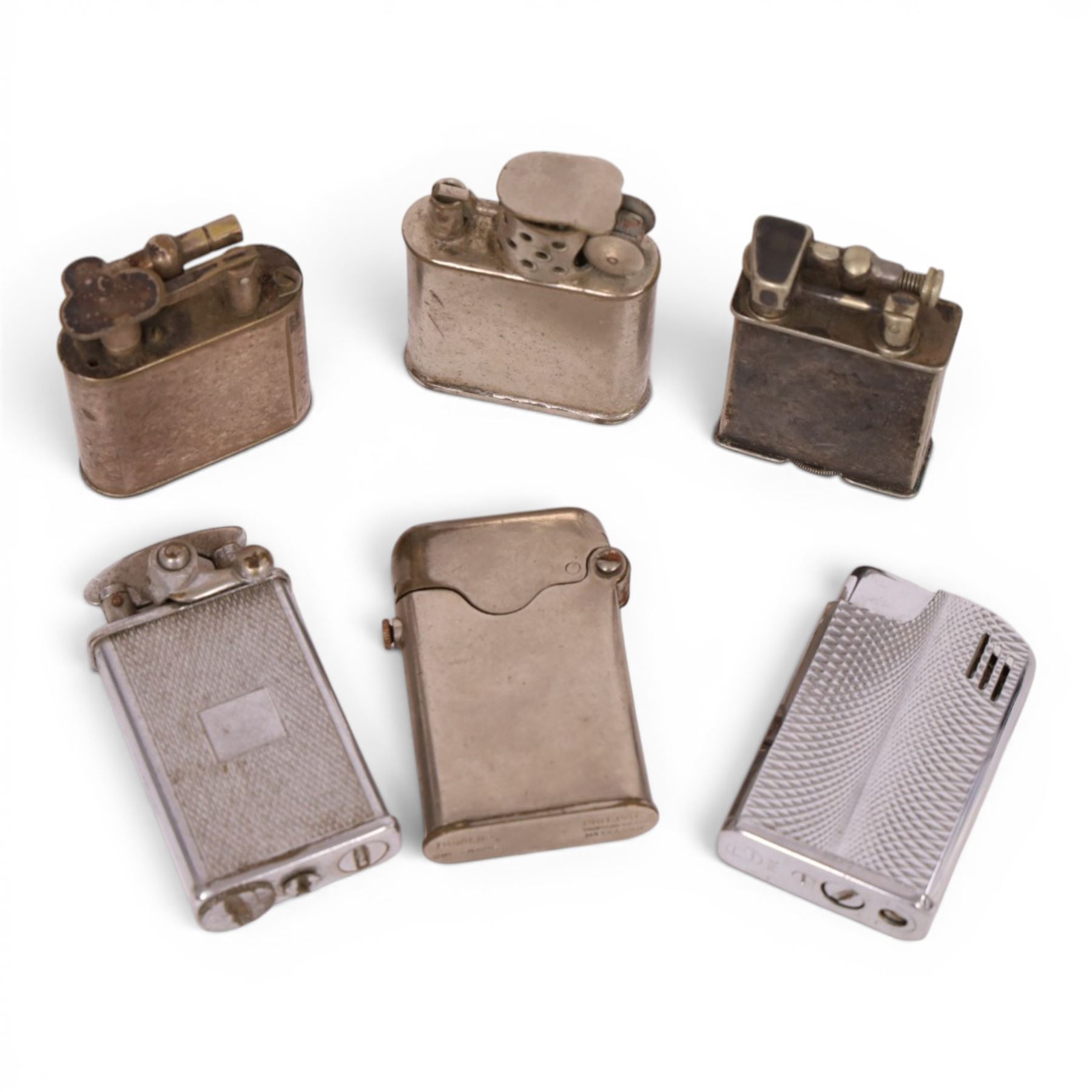 Collection of lighters including Parker Roller Beacon, Dunhill lift arm lighter. Patent no. 390107, Orlik Sport and three others 