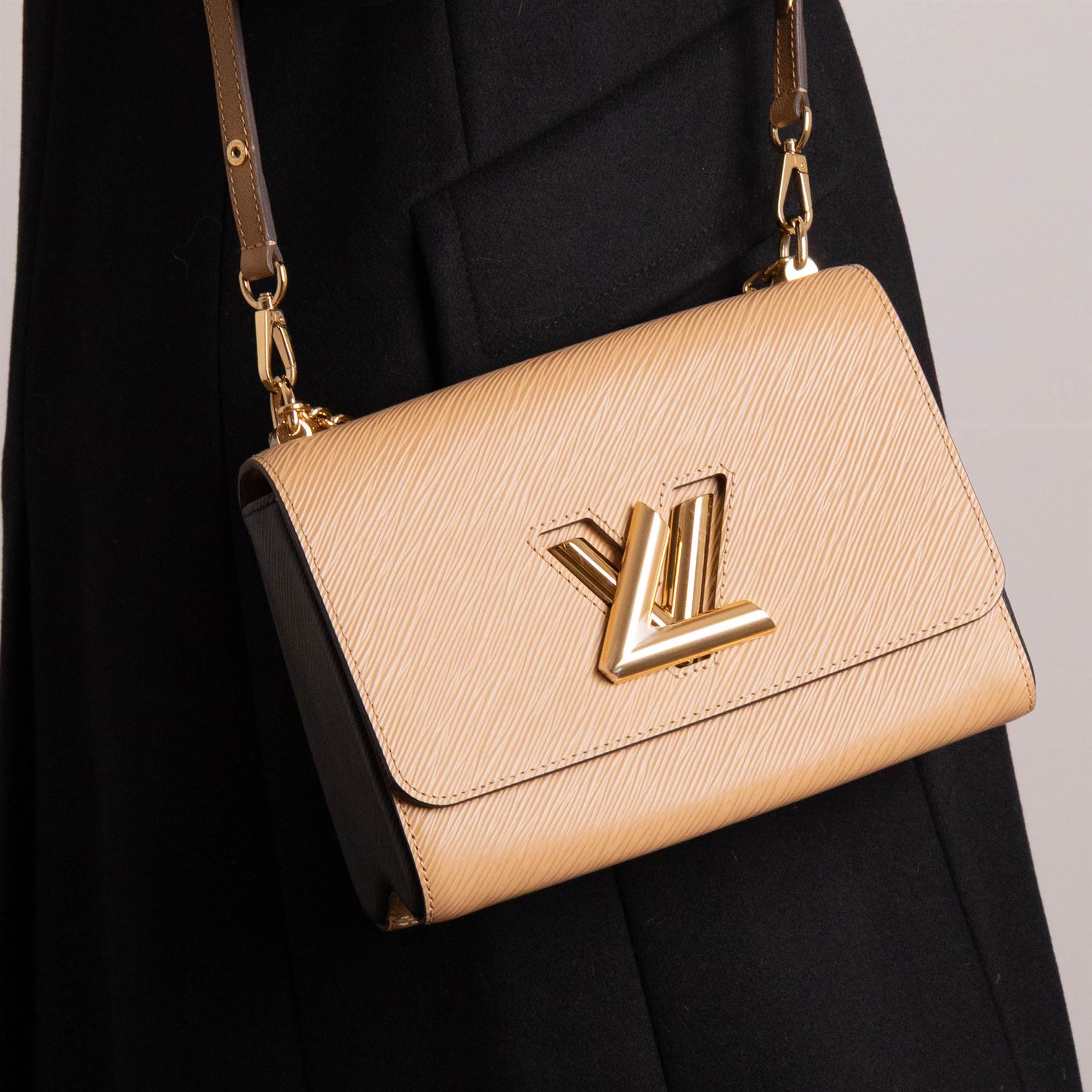 Louis Vuitton - ‘Twist’ MM Bag, the model introduced for the Cruise 2015 collection under Nicolas Ghesquière, in structured beige Epi cow hide leather with black sides, with gold-tone signature LV monogram twist-lock fastening and chain carrying handle, with detachable flat leather shoulder or crossbody strap, unused with original box and dust bag