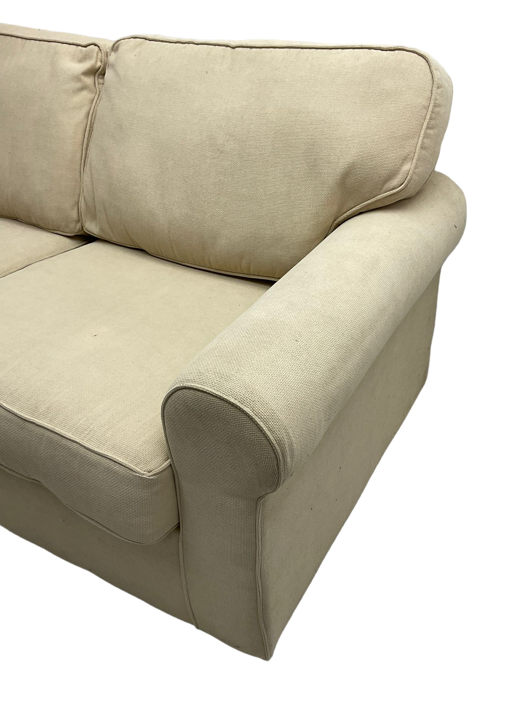 Harrods - traditional shaped two seat sofa bed, upholstered in textured beige fabric