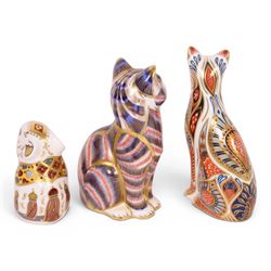 Three Royal Crown Derby paperweights, comprising Field Mouse gold stopper, Siamese cat gold stopper and seated cat gold stopper