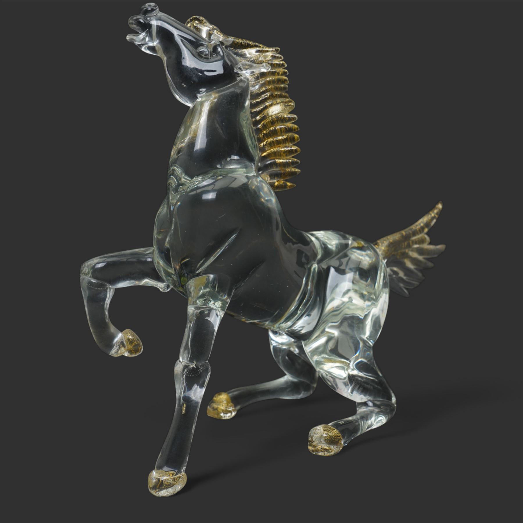 After Oscar Zanetti - Two Murano glass rearing horses with aventurine details to mane tail and hooves, larger 35cm and a Murano dolphin H24cm (3)