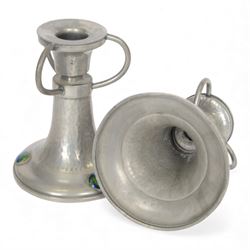 Pair of  Jugendstil hammered pewter candlestick each set with three blue and green enamel roundels, marked Germany beneath, H12cm