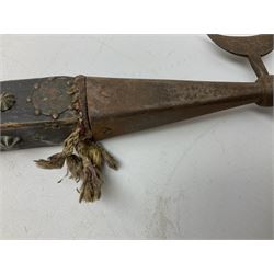 Eastern ceremonial or processional halberd, the square section hardwood handle studded and mounted all over with coins from various countries L85cm