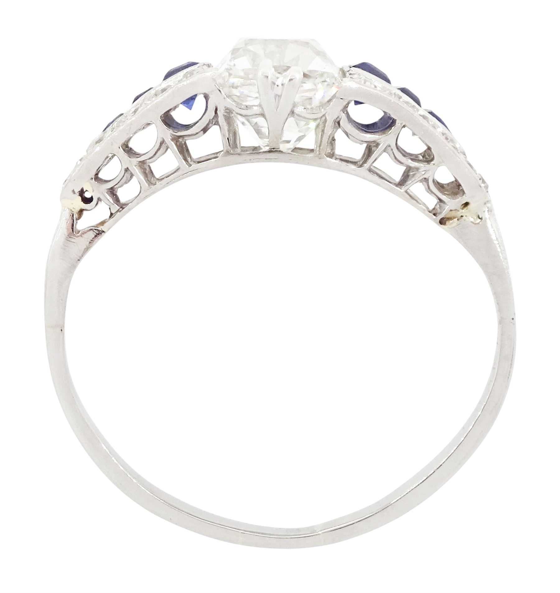 Platinum diamond and sapphire ring, the principal old cushion cut diamond of approx 1.50 carat, each side set with three graduating calibre cut sapphires and old cut diamond surround