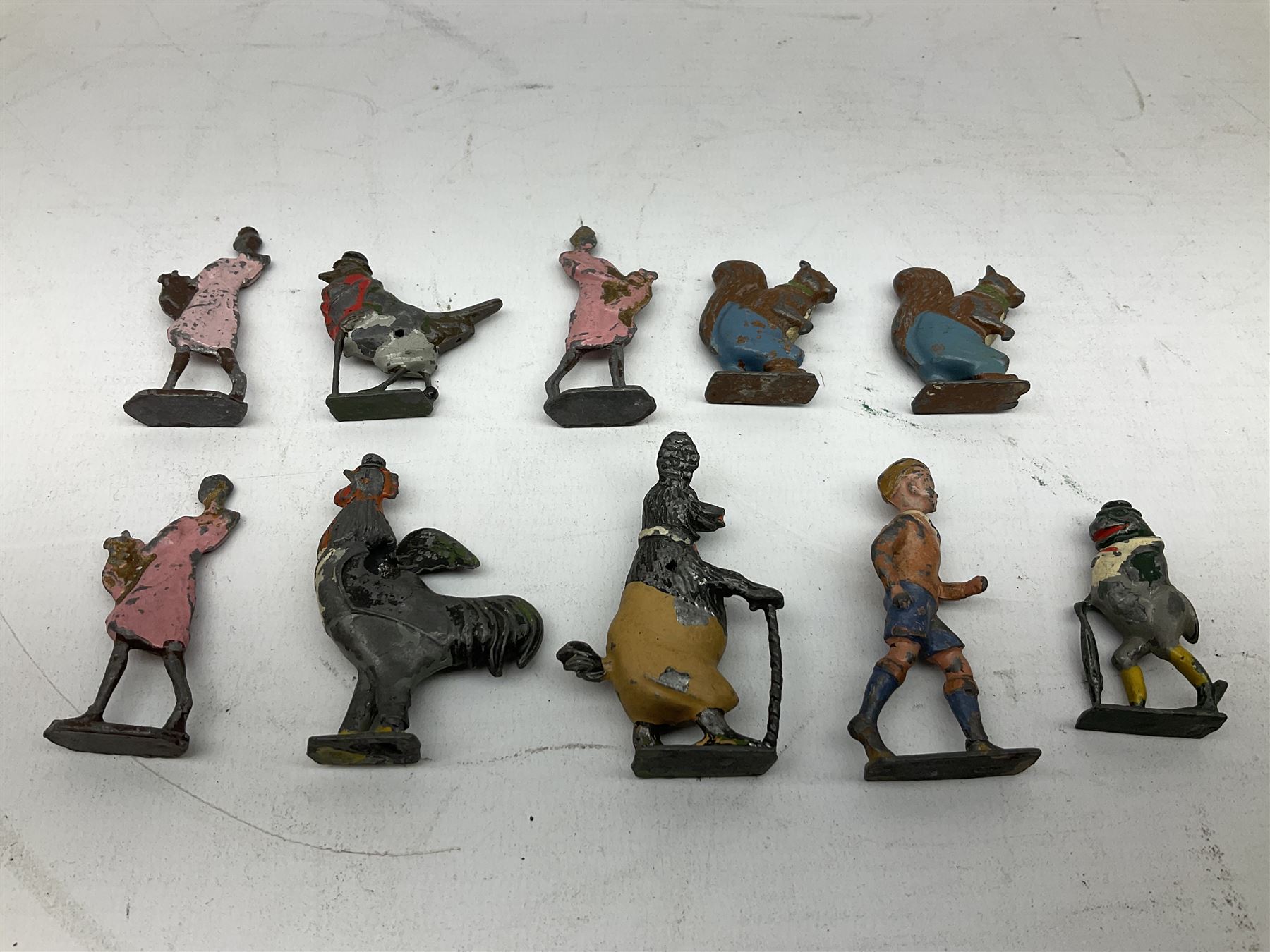 Collection of twenty-two Britains Cadbury's Cococubs play worn lead painted figures to include Mr Pie Porker, Mrs Pie Porker, Tiny Tusks, Captain Kangaroo, Granny Owl and others, Britains Snow White and Doc lead figures and other painted lead figures (30)