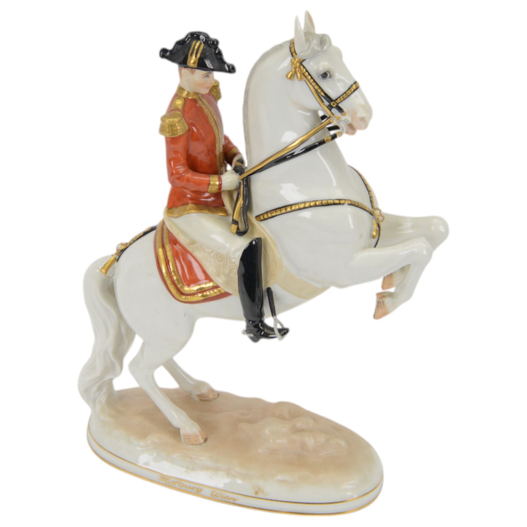 Royal Vienna Augarten figurine, modelled a Spanish Riding School rider upon rearing horse, with Trab-Spanische Reitschule Hofburg Wien in gilt to the base, H30cm