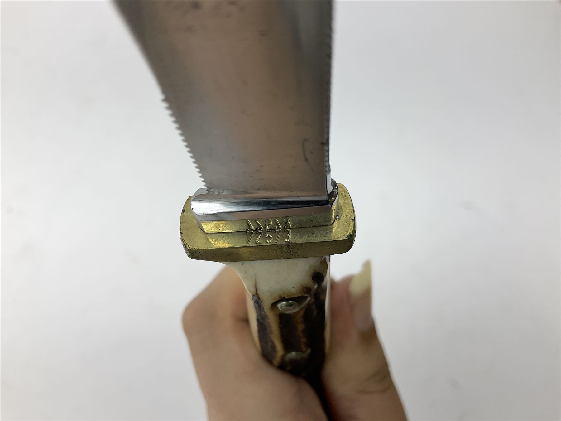 German Puma Hunter's-Pal knife, the 10cm steel blade marked model 6397, serial No.72573 to guard, fixed blade, antler scales; in original hard plastic case with paperwork and guarantee label; with brown leather sheath marked Puma L22.5cm overall