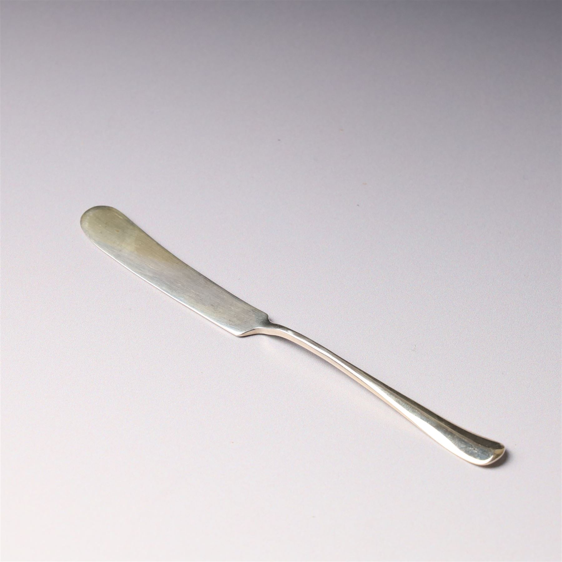 Silver six division toast rack with loop handle Sheffield 1938 Maker Viners and a silver butter knife