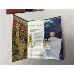 The Royal Mint United Kingdom 1984 brilliant uncirculated coin collection, 1997 and 2001 commemorative crown coins, 1997 old round one pound, all in card folders and four sterling silver medallic first day covers from the 'Great Britons' collection housed in a blue folder