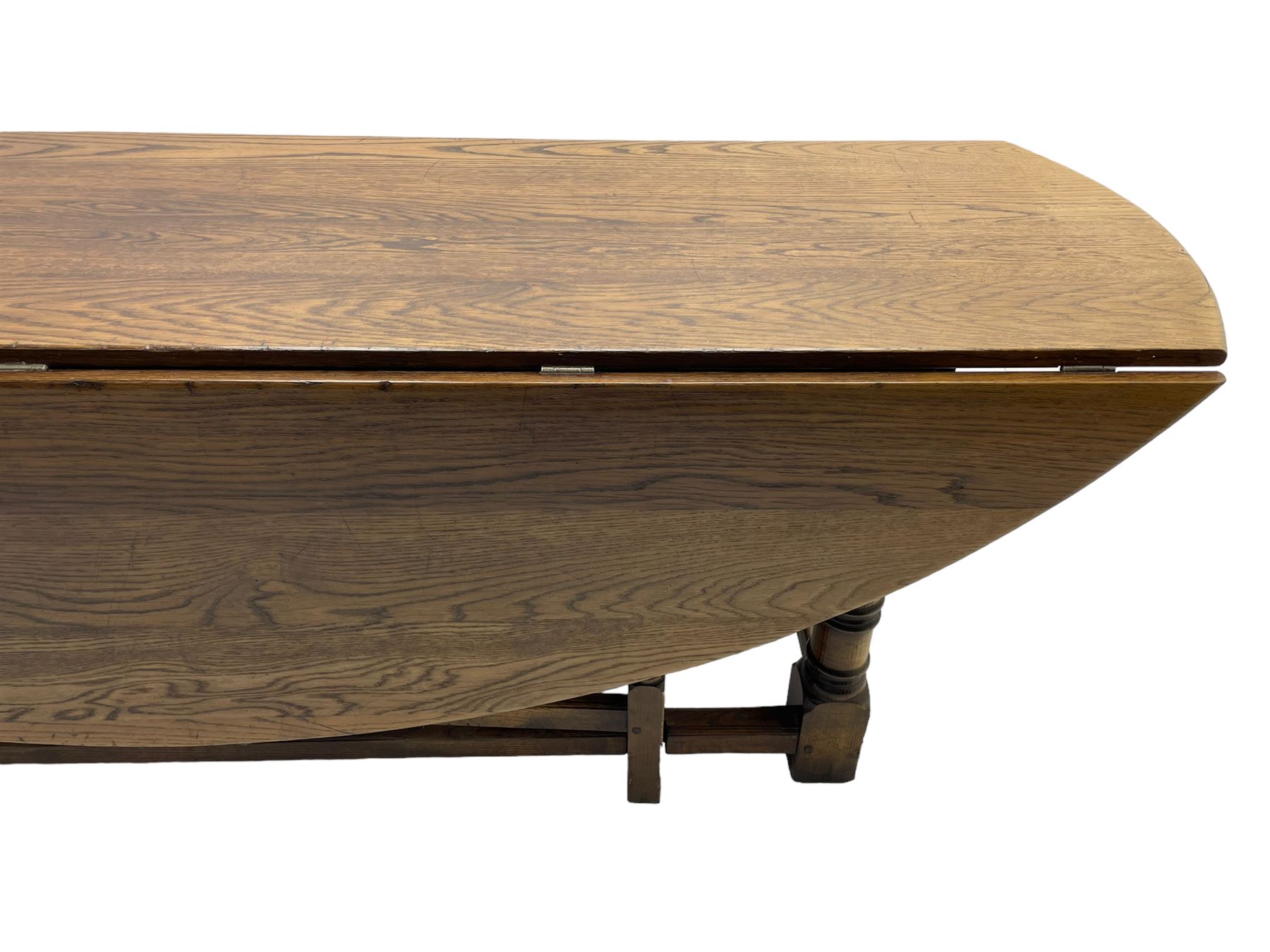 Large 18th century design oak wake or dining table, oval drop-leaf top, turned supports with double gate-leg action base, united by moulded stretchers 