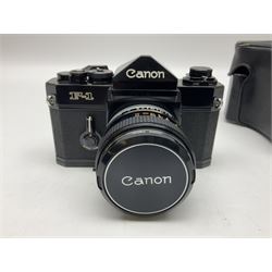 Canon F1n camera body, serial no. 572972, with 'Canon FD 50mm 1:1.4' lens, serial no. 246665, with leather case 