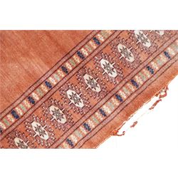 Small Afghan rust ground rug, plain field enclosed by patterned borders (94cm x 64cm); small Persian Hamadan indigo ground rug, decorated all-over with small flower head and bird motifs (118cm x 66cm); and a small Persian red ground rug (94cm x 62cm) (3)