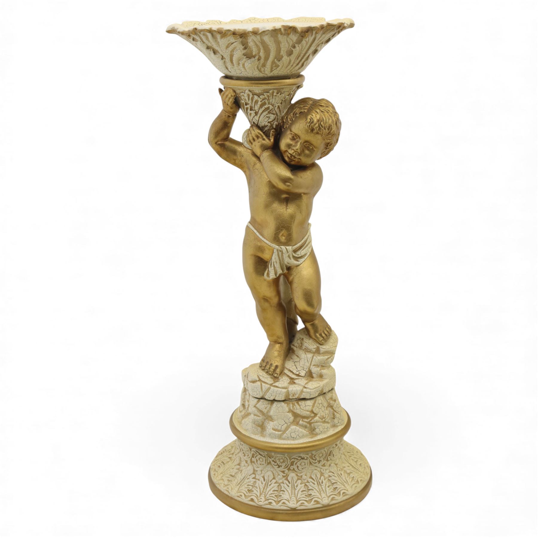 Late 20th century group of three decorative torcheres, comprising a putto-support stand (H 96cm, W 34cm), a gilt and painted columnar torchere on tripod base(H 112cm, W 48cm), and a gilt figural torchere with oval top (H 76cm, W 36cm)