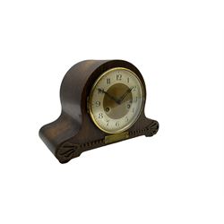 An oak cased 1930’s eight-day German mantle clock manufactured by HAC (Hamburg Amerikanische Uhrenfabrik), spring driven movement with a recoil anchor escapement striking the hours and half hours on a coiled gong, in round case with silvered chapter ring with Arabic numerals and minute markers, steel spade hands within a brass bezel and convex glass. With a presentation plaque to the front of the case. With pendulum.


