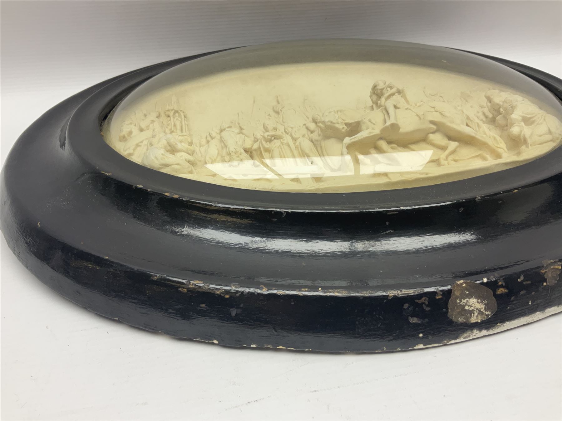 Justin Mathieu; oval high relief plaque depicting a battle scene, within frame H36cm